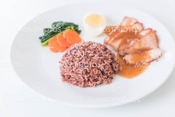 Barbecued red pork in sauce with berry rice