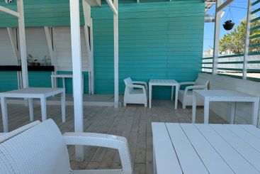 Interior of a summer wooden restaurant white and blue