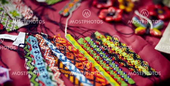 Ribbons embroidered by a bead.