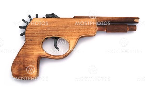 Toy wooden gun , on a white background
