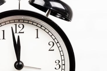 Close up of a black vintage alarm clock