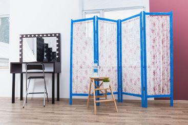 Blue wooden decorating screen with textile panels