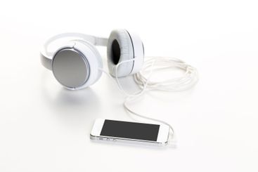 White headphones on white background close up