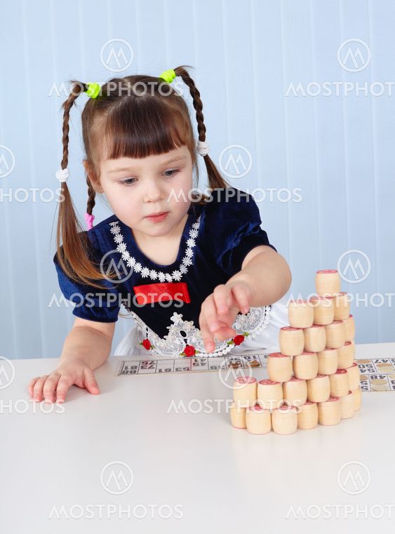 Preschool-age girl playing with Lotto