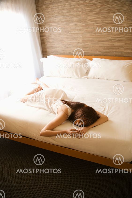 Woman on bed.