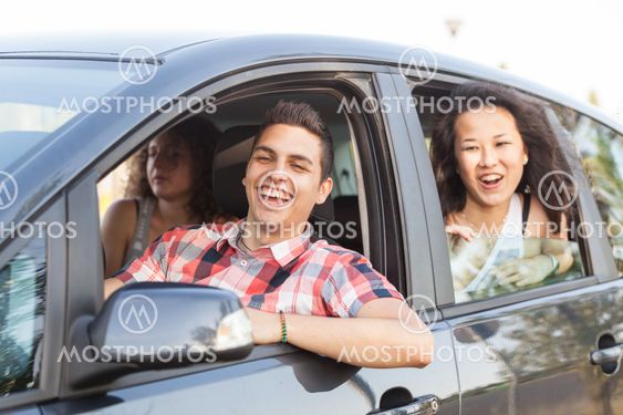 Boys and Girls in a Car Leaving for Vacation