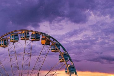Ferris Wheel in Helsinki, Finland. Purple evening sky on...