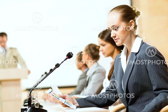 businessmen talking at the conference