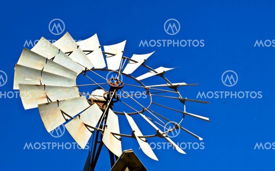 Rural Australian windmill against blue sky