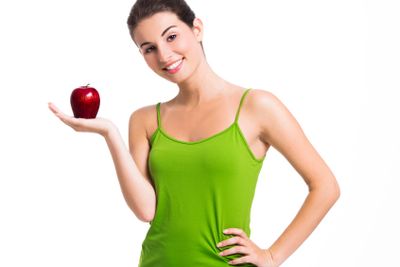 Healthy woman holding an apple