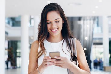 Professional, woman and phone for reading with smile for...