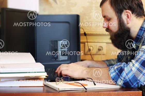 man write pen table