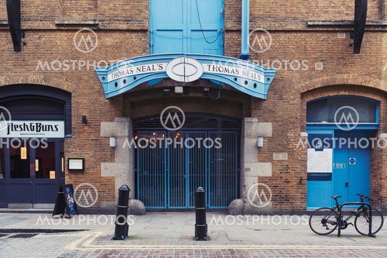 London, UK - April 2018: Front facade of the Thomas Neal’s Warehouse, space for retail shops, offices, entertainment and residence, located on Earlham Street between Soho and Covent Garden in central London near Seven Dials