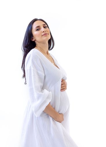 Portrait of an attractive young pregnant woman in a...