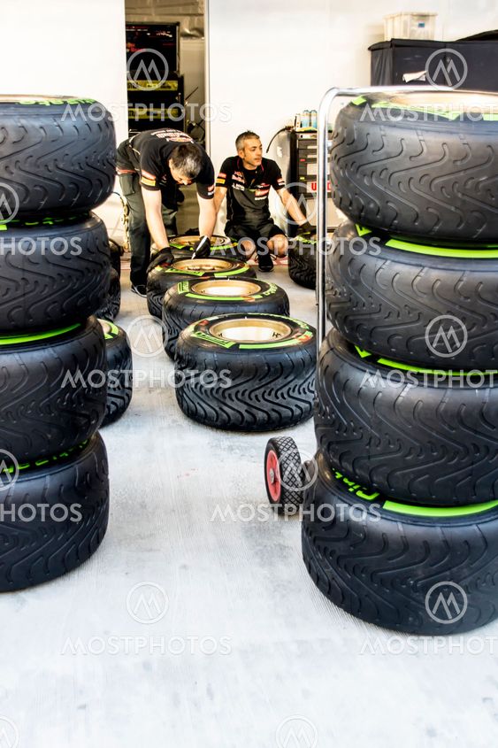 Scuderia Toro Rosso. Mechanics. Checking the tyres before...