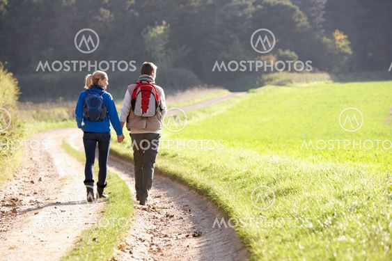 Young couple walking in park