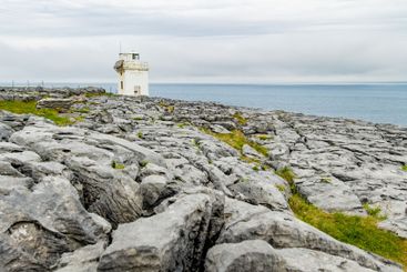 Black Head Lighthouse, situated in the rough rocky...