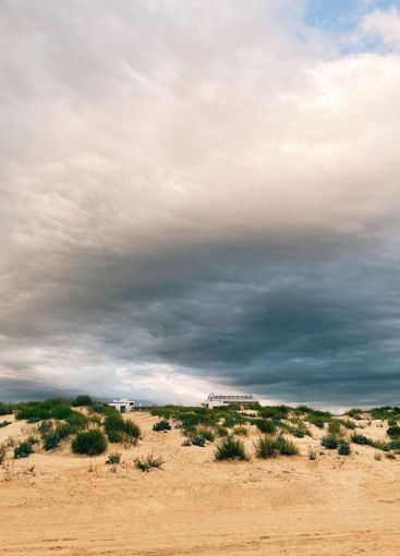 Landscape moody photo of sand dunes and coastal seascape...