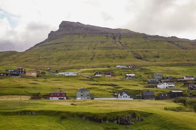 Village in wild and beautiful landscape of Faroe Islands,...