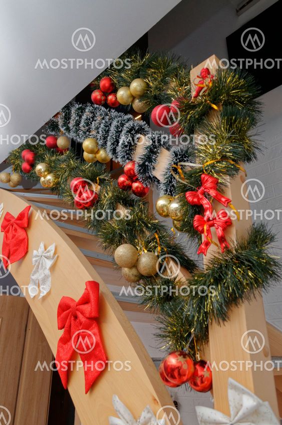 stairs in the house decorated for the holidays