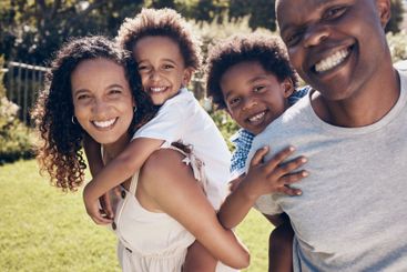 Happy, garden and portrait of parents with children in...