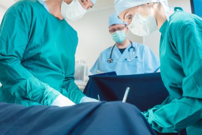 Surgical doctor in full concentration on operation