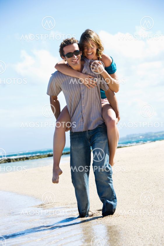 Man carrying woman.