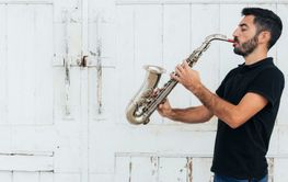 front view man playing saxophone 4