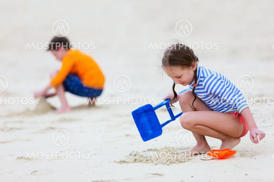 Two kids playing at beach
