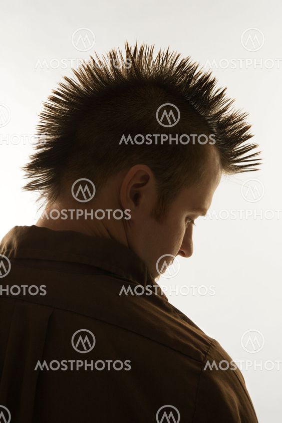 Caucasian man with mohawk.