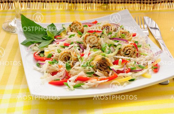 Scrambled eggs with green onions, fresh vegetables and...