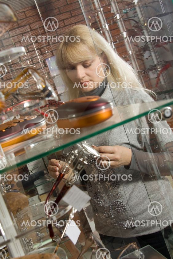 woman trying on glasses