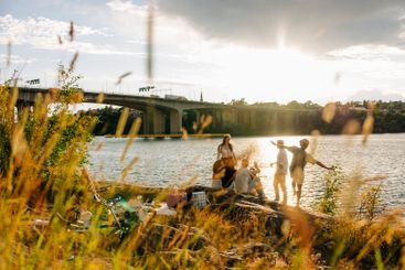 Male and female friends spending leisure time while...