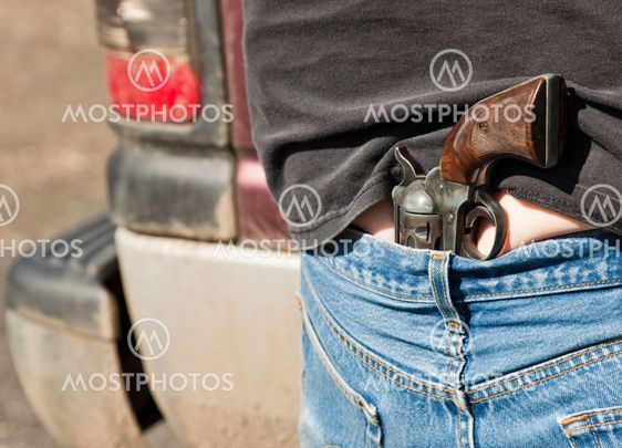 Pistol Tucked into Jeans