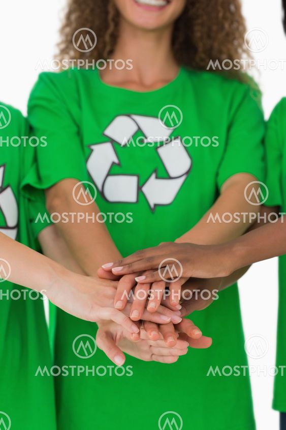 Team of environmental activists putting hands together