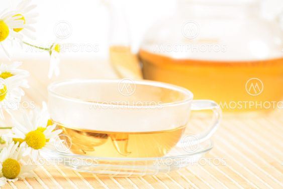 teacup with herbal chamomile tea