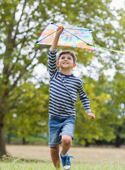 Boy playing with kite