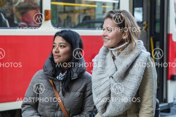 Two Young Women at Tram Stop