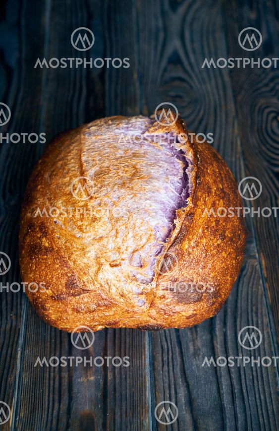 Homemade tartine bread on dark wooden table