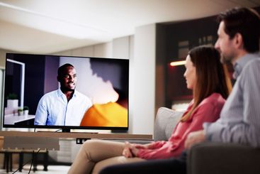 Night in with a movie: couple watching TV