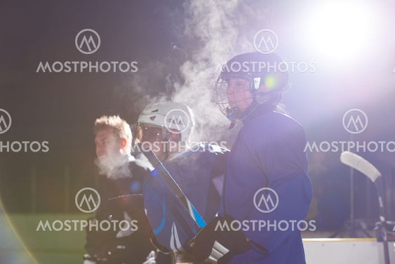 ice hockey players on bench