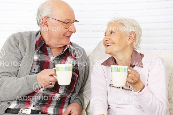 Senior citizen couple drinking coffee
