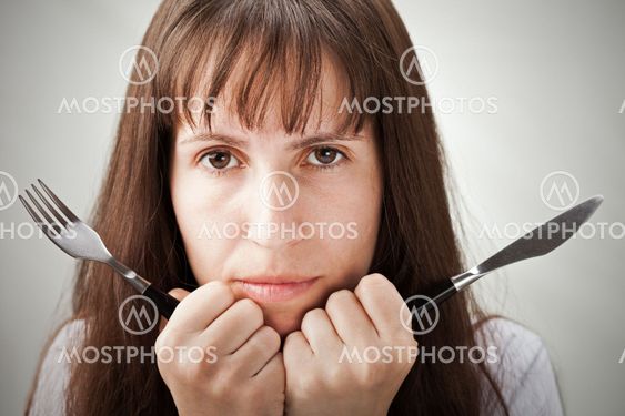 Women hand holding fork and knife