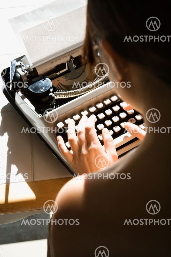 Nude woman typing.