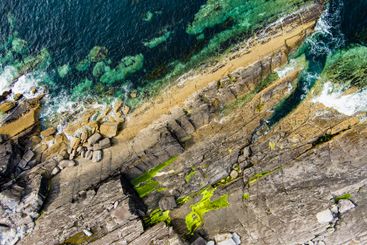 Aerial view of rough rocky shore along famous Ring of...