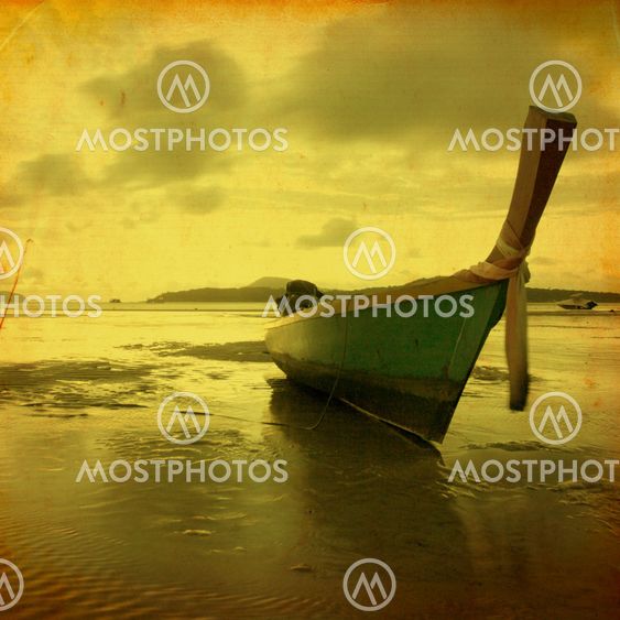 Retro beach with long Tail boat