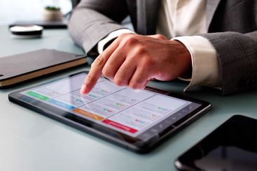 Professional African American Man Using Kanban Software