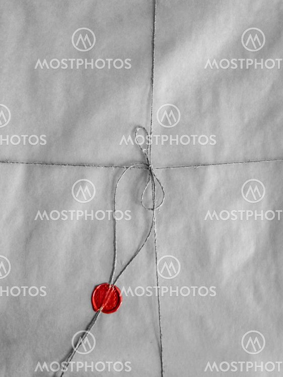 old envelope packed with twine and red seal wax