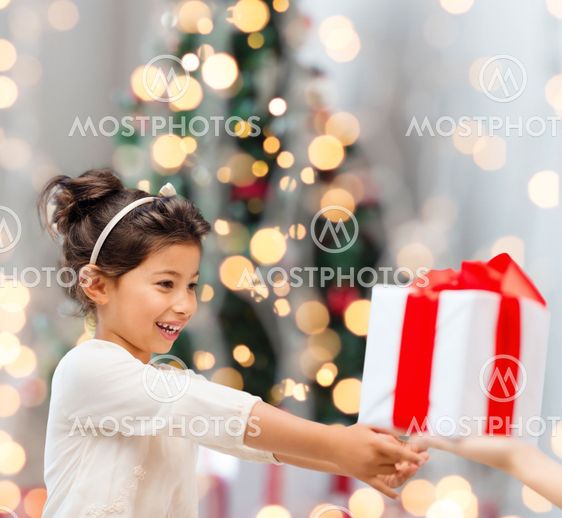 smiling little girl with gift box
