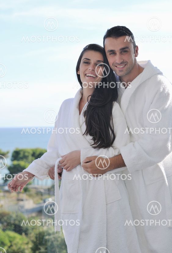 couple relaxing on balcony